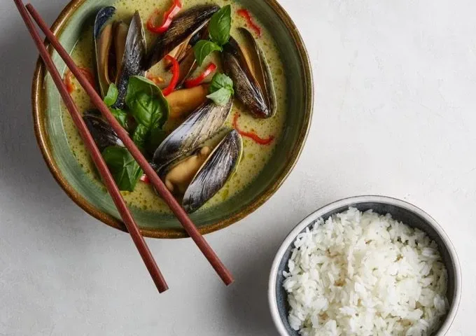 Thai Mussels curry in bowl with jasmine rice